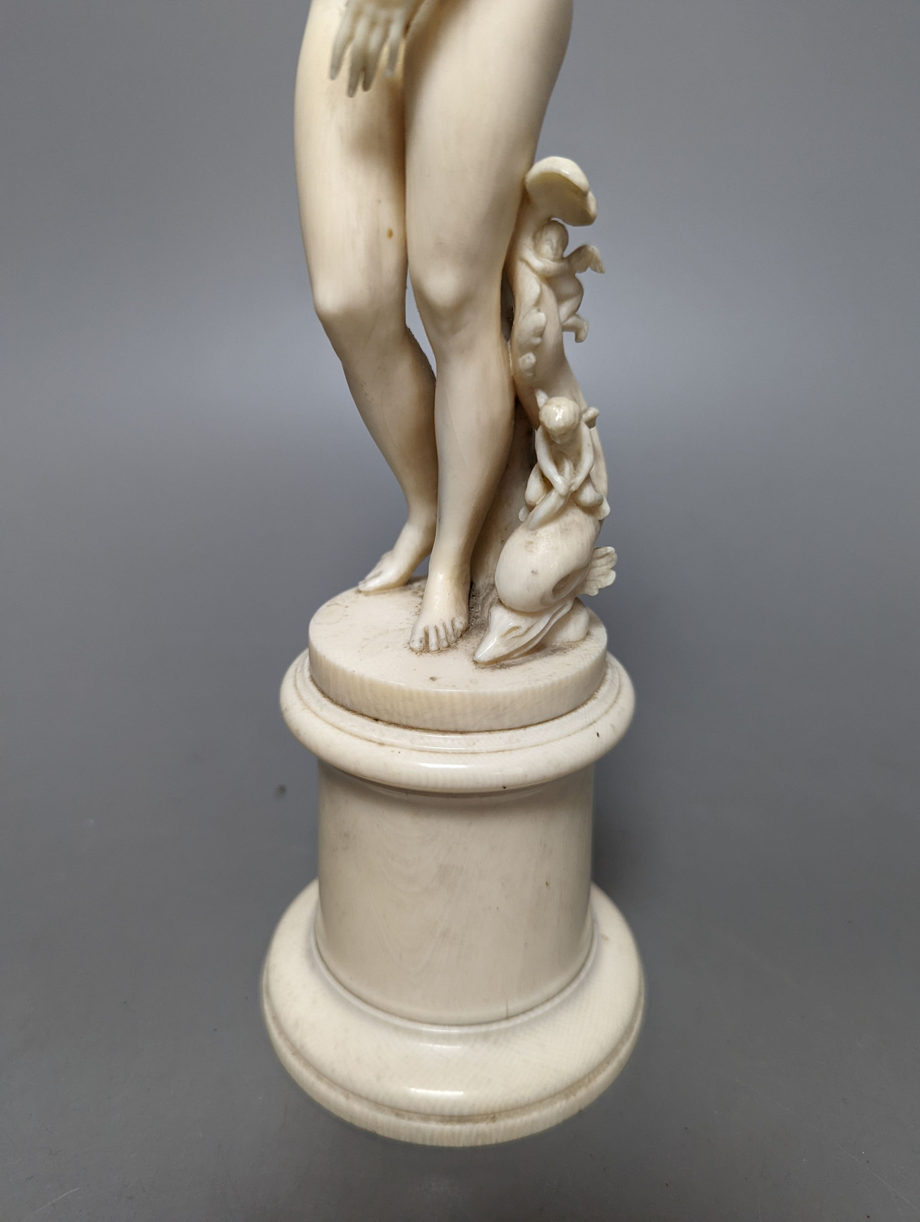 A 19th century Dieppe ivory figure after the antique ‘Venus with dolphin’ 25cm